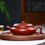 「梅影壶 · Plum Whisper」 — 180ml Handmade Yixing Purple Clay Teapot (Raw Ore Da Hong Pao Clay · Hand-Engraved Plum Blossom Motif · Folk Artisan Work)