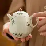 「绘影龙角壶 · Prism Bloom」 — 200ml Hand-Drawn Ceramic Teapot (Multi-Faceted Dragon Egg Form · White Porcelain Base · Built-in Filter · Chinese Style Motif)
