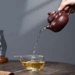 「梅影壶 · Plumtrace」 — 230ml Handmade Yixing Purple Clay Teapot (Raw Ore Zisha · Floral Engraving · Beauty Form) - Image 3