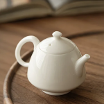 「羊脂玉瓷壶 · Cloudglow」 — 90ml Sheep Fat Jade Porcelain Teapot (Handmade Miniature Gongfu Pot · Built-in Filter · Household & Travel-Friendly Brewing Vessel)