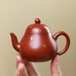 「洒金梨壶 · Gilded Ember」 — 90ml Handmade Yixing Purple Clay Teapot (Raw Ore Zhu Ni · Sprinkle Gold Pear Form · Boutique Craftsmanship)