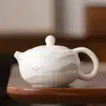 Dehua sheep fat jade white porcelain single person teapot household ceramic ball hole filter tea making Xishi teapot
