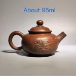 「花隐壶 · Petalshade」 — 95ml Handmade Jianshui Purple Clay Mini Teapot (Raw Ore Jianshui Clay · Carved Floral Motif · Miniature Gongfu Form)