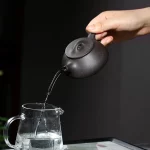 「砺影藏真 · Grindstone Form」 — 190ml Handcrafted Yixing Purple Clay Teapot | Ball Hole Filter for Gongfu Brewing · Famous Artisan Edition - Image 3