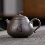 「梨形壶 · Calligrapot」 — 200ml Handmade Yixing Purple Clay Teapot (Raw Ore Zisha · Pear-Shaped Form · Calligraphy Engraving)