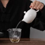 「木影西施壶 · Woodshade Grace」 — 180ml Handmade White Porcelain Teapot (Xishi Form · Raw Wood Side Handle · Gongfu Brewing Vessel) - Image 4