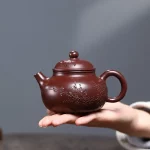 「梅影壶 · Plumtrace」 — 230ml Handmade Yixing Purple Clay Teapot (Raw Ore Zisha · Floral Engraving · Beauty Form)