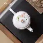 「桃影壶 · Spring Whisper」 — 130ml Pure Hand-Painted Peach Blossom Teapot (Modern Chinese Style · Porcelain Clay Body · Built-in Chhai Filter · Handmade for Puer & Gongfu Brewing) - Image 3