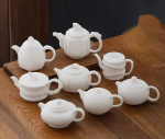 「素影玉壶 · Whisper Clay」 — 150ml Dehua Sheep Fat Jade White Porcelain Teapot (Unglazed Biscuit Ware · Handmade Boutique Gongfu Pot · Ball Filter · Ceremony & Collection Gift)
