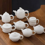 「素影玉壶 · Whisper Clay」 — 150ml Dehua Sheep Fat Jade White Porcelain Teapot (Unglazed Biscuit Ware · Handmade Boutique Gongfu Pot · Ball Filter · Ceremony & Collection Gift)